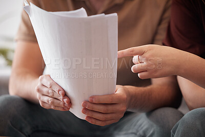 Buy stock photo Shot of a couple going through some bills together