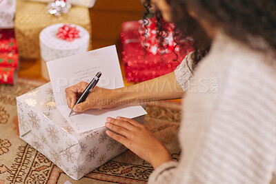 Buy stock photo Christmas, writing and woman with letter for gift, present and surprise for tradition in home. Party, celebration and hands of person with paper in living room for vacation, festive event and holiday