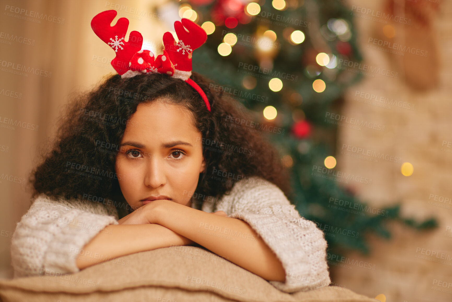 Buy stock photo Portrait, lonely and sad woman on sofa at Christmas with crisis, frustrated face and holiday in lounge at home. Mental health, vacation and girl with depression on couch in living room with xmas tree