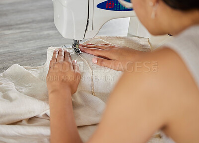 Buy stock photo Rearview shot of a woman using a sewing machine in her workshop