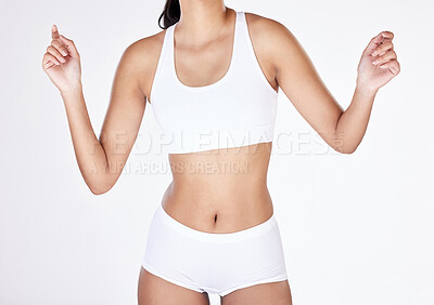 Buy stock photo Closeup, body and woman with underwear, hands and fitness on white studio background. Person, balance and model with panty, stomach and exercise with gut health, training and workout with wellness