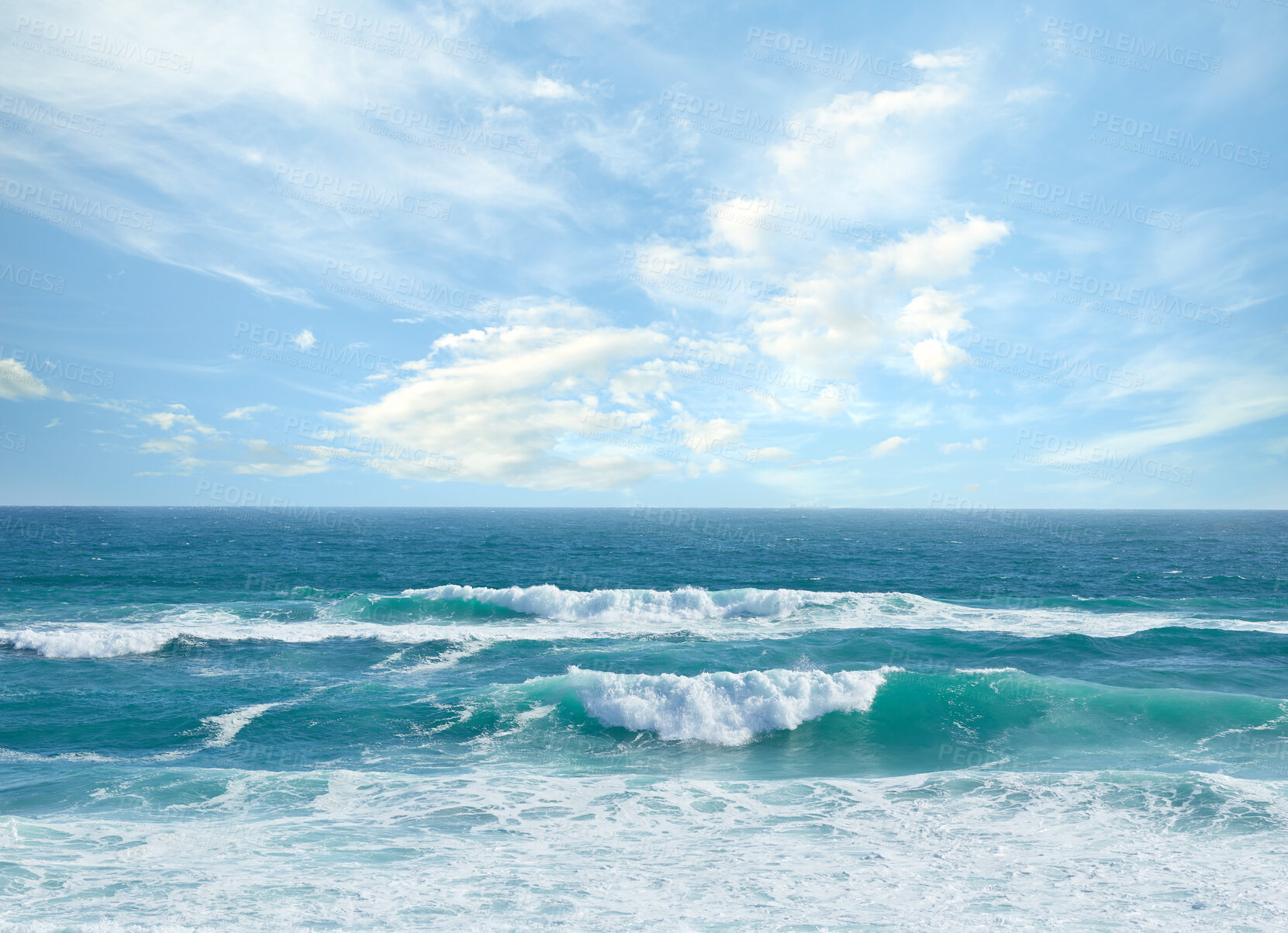 Buy stock photo Landscape banner view of waves rolling onto the seashore against a cloudy blue sky in summer. Peaceful scenic view of clear beach water in a tropical area. Relaxing natural environment on the coast