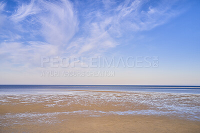 Buy stock photo Blue ocean view of calm sea water on a summer morning. Nature landscape of a coastline with a blue sky and white clouds over the horizon. Seaside scene of tides and currents on a beautiful beach day