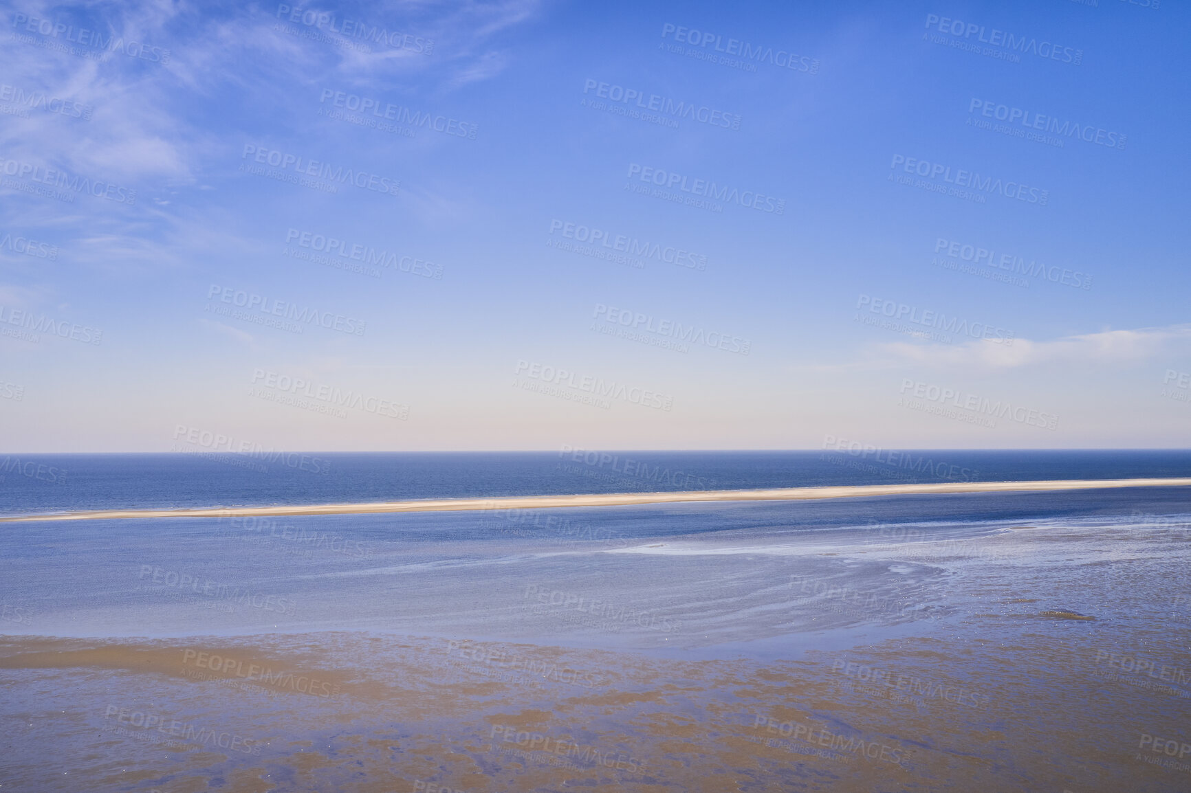 Buy stock photo Beautiful landscape of an empty beach against a blue sky background on a summer morning. A peaceful and quiet view of the ocean and the sea shore with copy space on a spring day