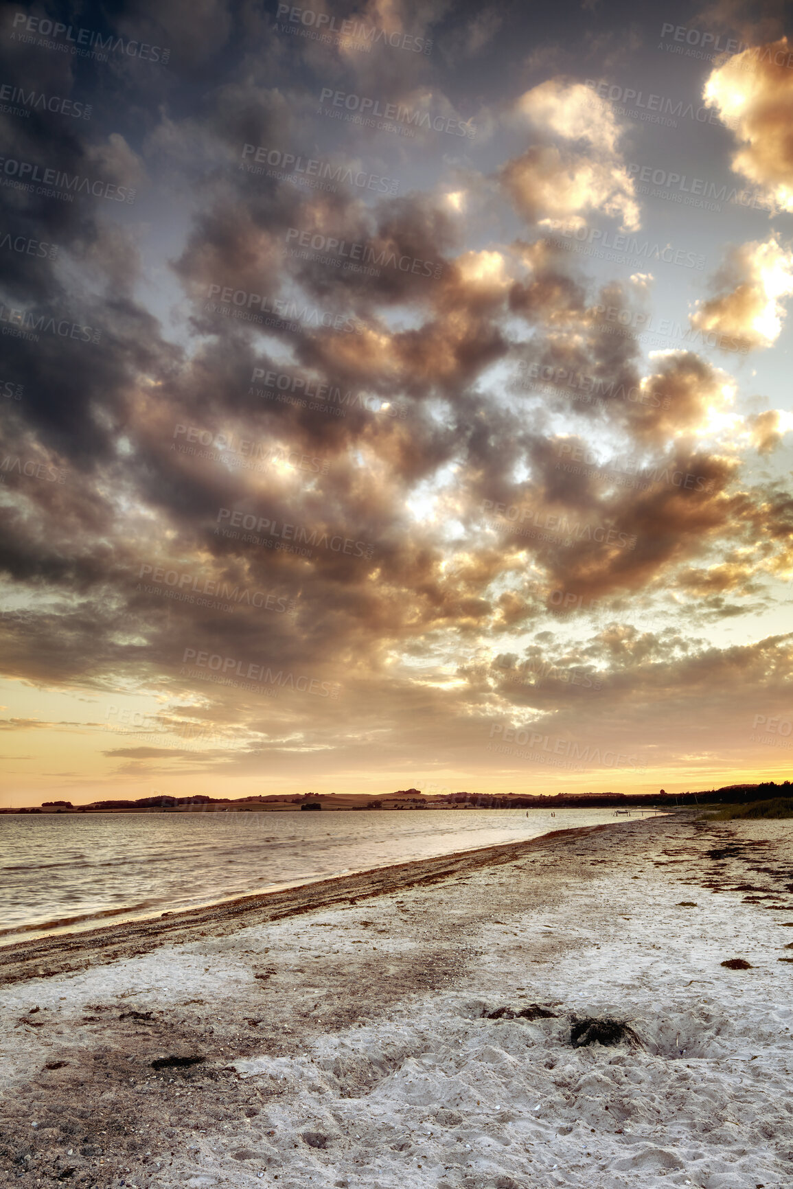 Buy stock photo Beach view of sky and clouds at sunset with calm sea water in summer. Nature landscape of a coastline with a cloudy scene over the horizon. Seaside tides and currents on a bright and beautiful day