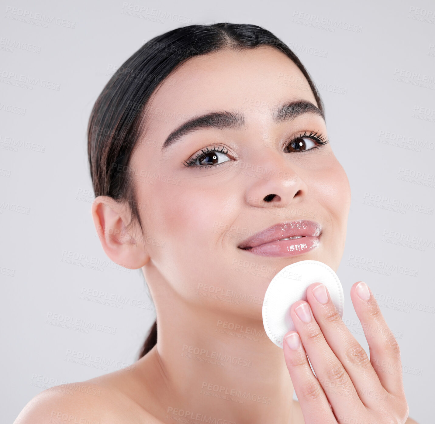Buy stock photo Happy woman, portrait and skincare with cotton pad for exofliation or facial on a white studio background. Face of young female person with smile for beauty foundation, grooming or makeup removal 