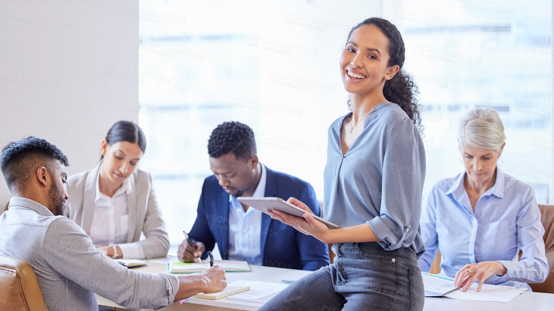 Buy stock photo Shot of a confident young businesswoman working in a modern office