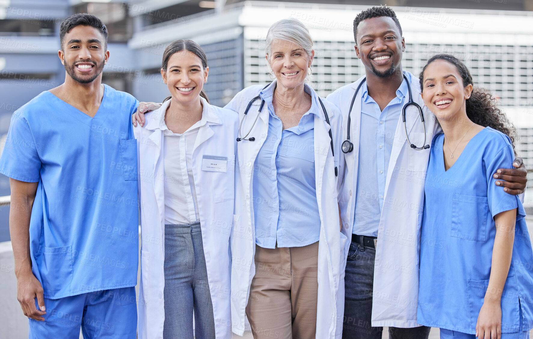 Buy stock photo Doctor team, city and hug with diversity and happy nurse from healthcare and wellness work. Urban, nursing and clinic group with doctors and support with success, motivation and smile outdoor