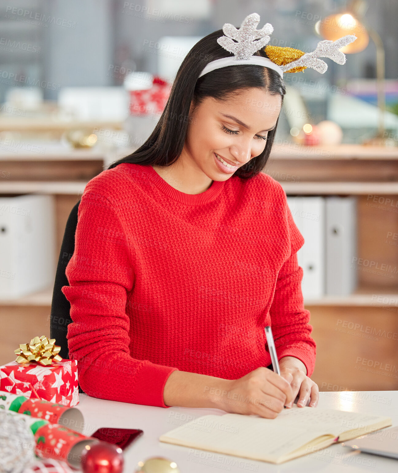 Buy stock photo Happy, woman and writing Christmas letters with reindeer hat for festive season for office party. Smile, female person and employee with paper and xmas gifts or presents for event celebration at work