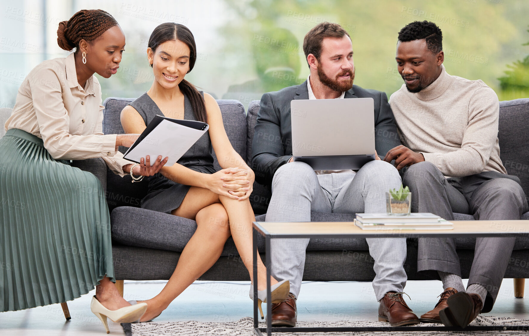 Buy stock photo Shot of a group of businesspeople working together in an office