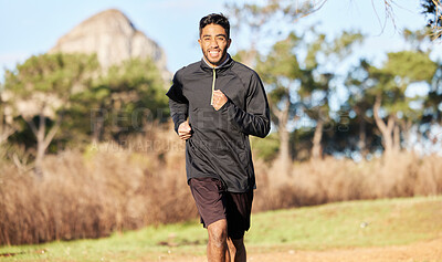 Buy stock photo Shot of a young man enjoying his morning run