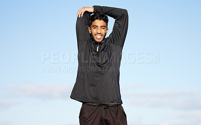 Buy stock photo Fitness, portrait and happy man stretching on blue sky background for running, training or morning cardio outdoor. Exercise, workout or Indian runner outside for body, warm up or resilience challenge