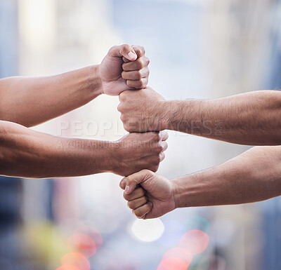 Buy stock photo Cropped shot of two unrecognisable businessmen standing together with their fists stacked