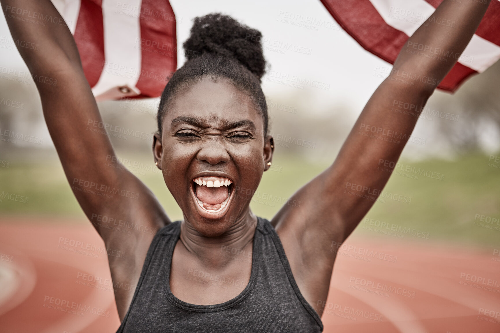 Buy stock photo Shot of a young female athlete celebrating her win while running with a flag