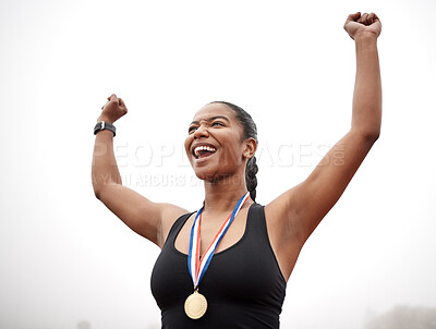 Buy stock photo Shot of a beautiful young female athlete celebrating at the end of her race
