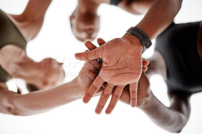 Buy stock photo Shot of a team of athletes with their hands stacked