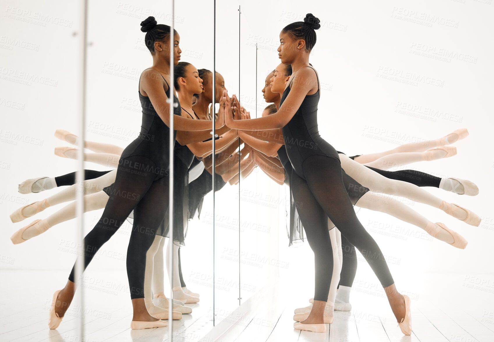 Buy stock photo Shot of a group of ballet dancers practicing a routine in a dance studio