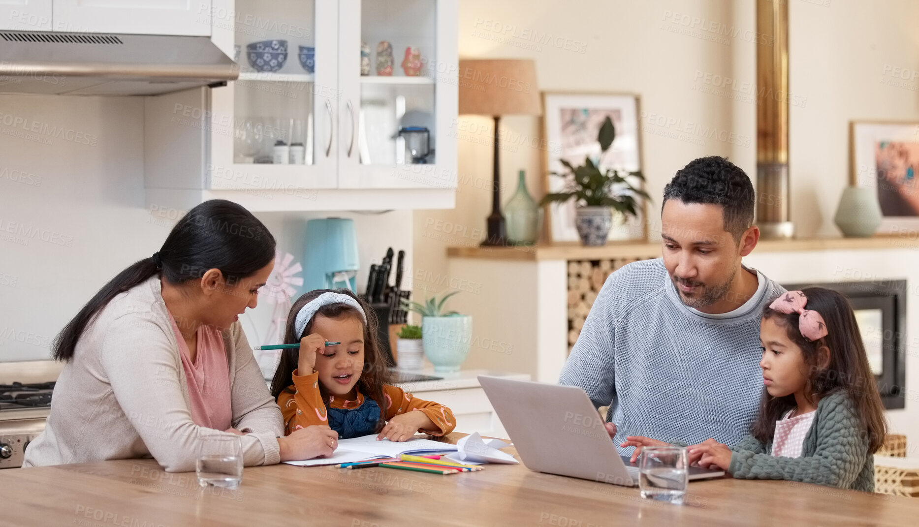 Buy stock photo Shot of two parents helping their children with their homework
