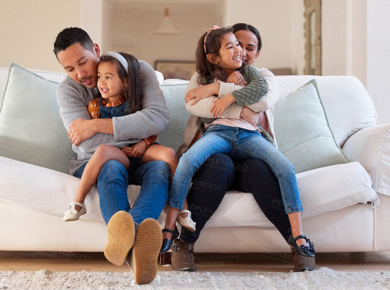 Buy stock photo Happy family, parents and children on sofa in home for bonding, support and security with playing for fun. People, smile and relax in living room with embrace, trust and hugging with love in house