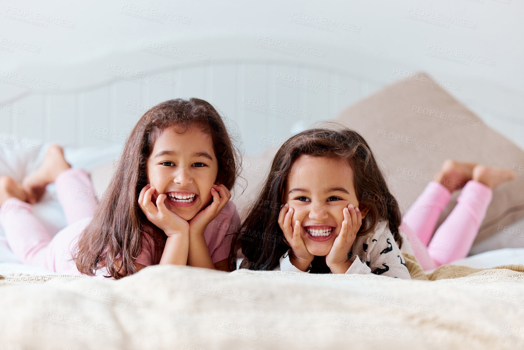 Buy stock photo Girls, sisters and portrait on bed in home for relax, happiness and bonding together on weekend. Children, family and female kids in bedroom with smile for connection, playing and love as siblings