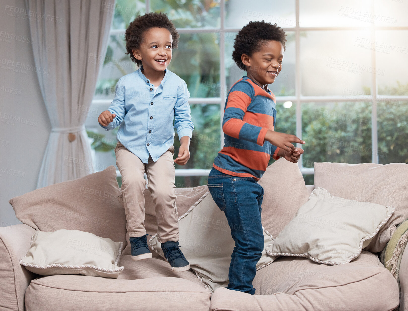 Buy stock photo Jumping, boys and fun on sofa, smile and energy for siblings, living room and game for children in home. Excited, kids and playing on couch, brothers and together in house, love and family in lounge