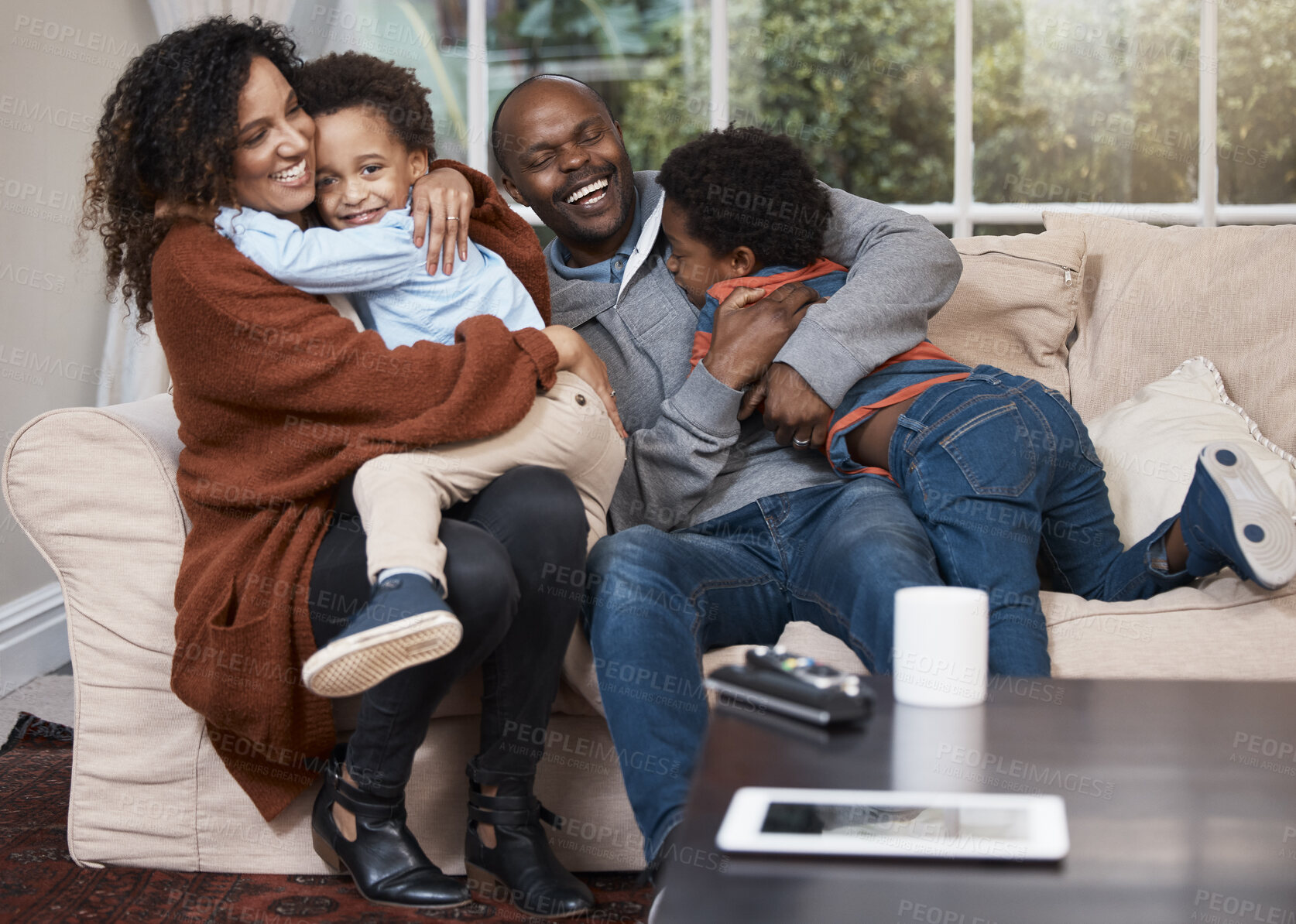 Buy stock photo Happy, black family and hug on sofa for love, trust and support in living room. Parents, children and relax at home for cuddle, relationship development and security on couch with bonding or care