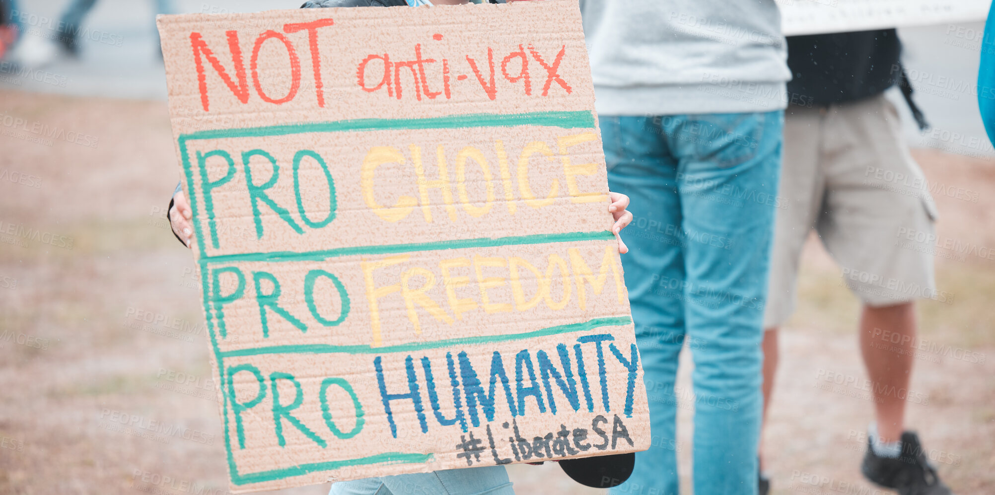 Buy stock photo Group, poster and protest in city for vaccine, covid and opinion with sign, medical and human rights. People, paper and crowd to stop pharma, choice and decision for health with freedom in street