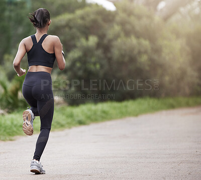 Buy stock photo Running in nature, woman from back and fitness, mockup space and trees on healthy workout on path. Exercise, health and wellness, girl runner on forest path with commitment to training on outdoor run