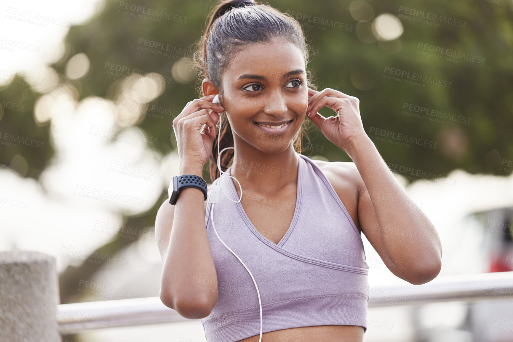 Buy stock photo Fitness, smile and woman with earphones in park on workout break listening to music or podcast. Exercise, training and happy girl with headphones for radio streaming service while running in nature.