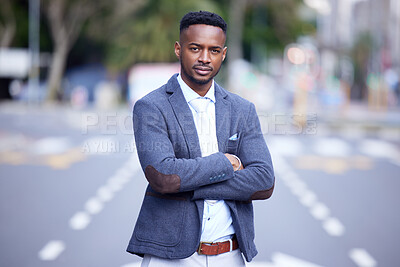 Buy stock photo Shot of a confident young businessman out in the city
