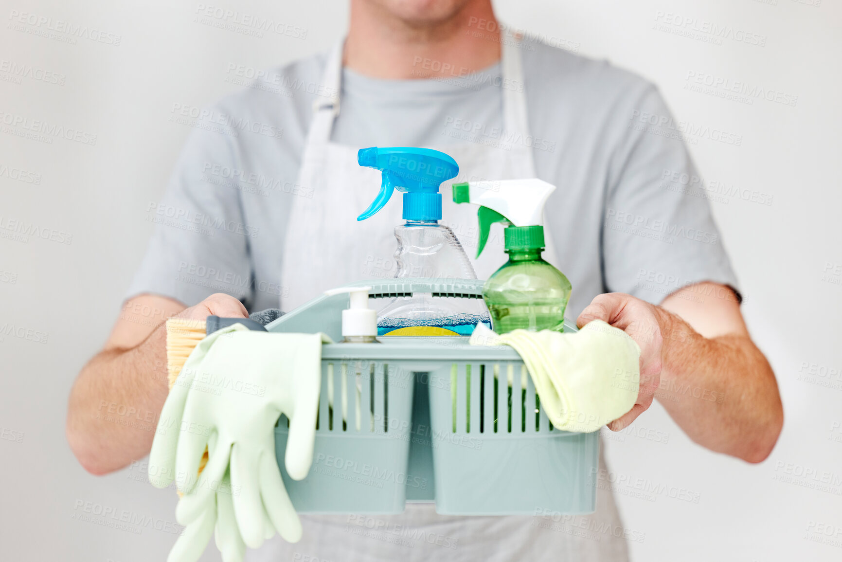 Buy stock photo Man, hands and basket with cleaning supplies in studio for spring cleaner, bacteria and housekeeping. Person, chemical liquid and hygiene product for housework or household chores on white background