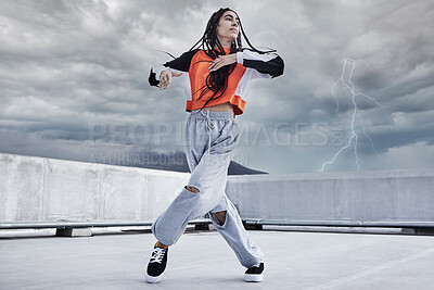 Buy stock photo Woman, dance and hip hop outdoor on city rooftop with lightning storm and cool gen z streetwear fashion. Girl, moving and dancer with creative energy on apartment balcony and urban style or freedom