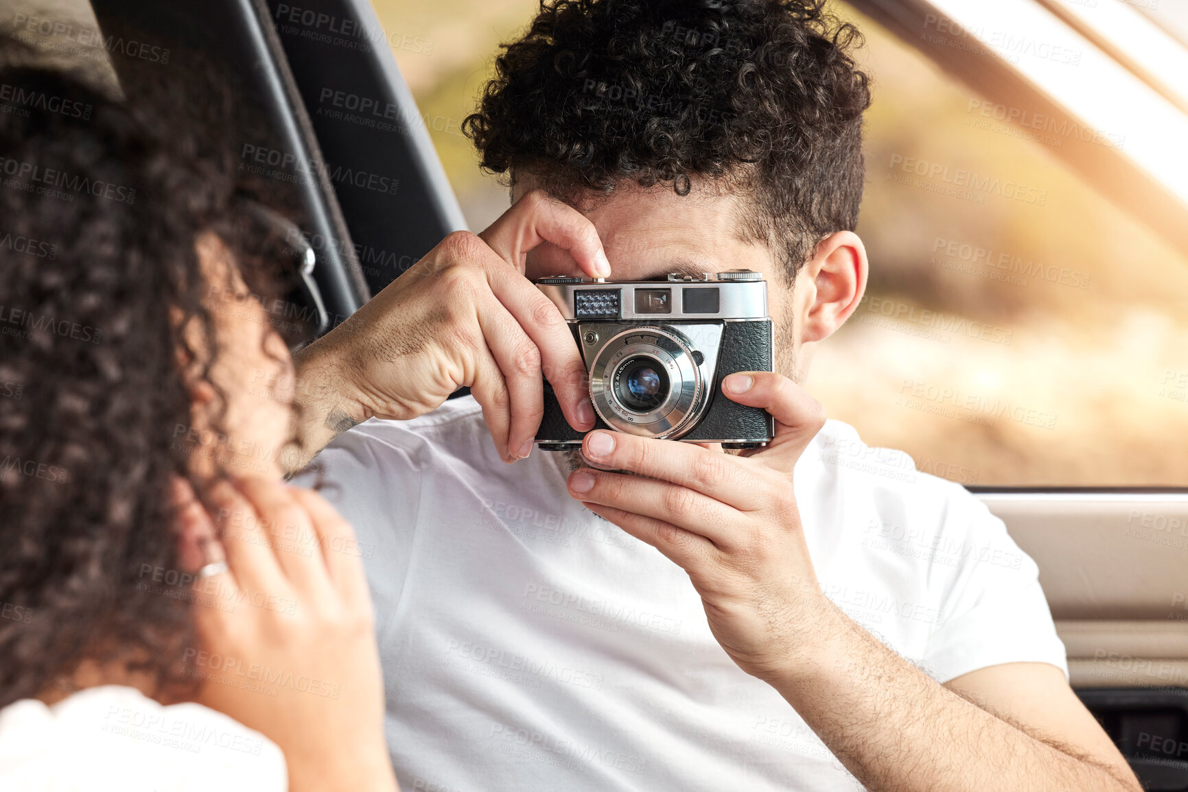 Buy stock photo Couple, photographer and car with memory for travel, sightseeing or capture together on road trip. Man and picture with woman with camera for photograph, moment or tour on outdoor journey in vehicle