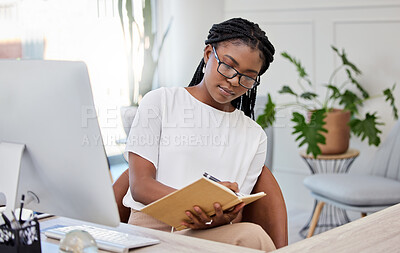 Buy stock photo Business woman, computer and book for writing notes  planning, agenda and office administration job. Black person, notebook and pc at desk to research ideas, information and web strategy online