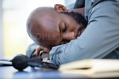 Buy stock photo Man, sleeping and tired consultant and desk, lazy employee and burnout for company project with fatigue. Overwhelmed,  stress and exhausted worker in call centre, nap and low energy or African person