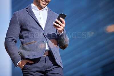 Buy stock photo Shot of a businessman using his smartphone to send a text
