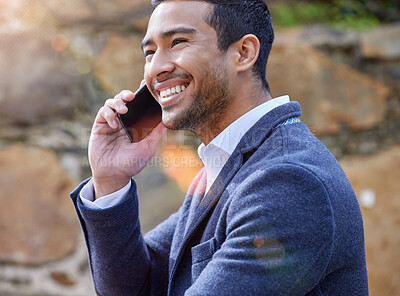 Buy stock photo Shot of a businessman using his smartphone to make a phone call