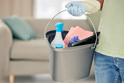 Buy stock photo Shot of a man holding a bucket of cleaning supplies
