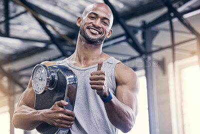 Buy stock photo Portrait, scale and thumbs up with bodybuilder man in gym for strength training or workout. Exercise, smile and success with happy athlete in health club for motivation, support or thank you