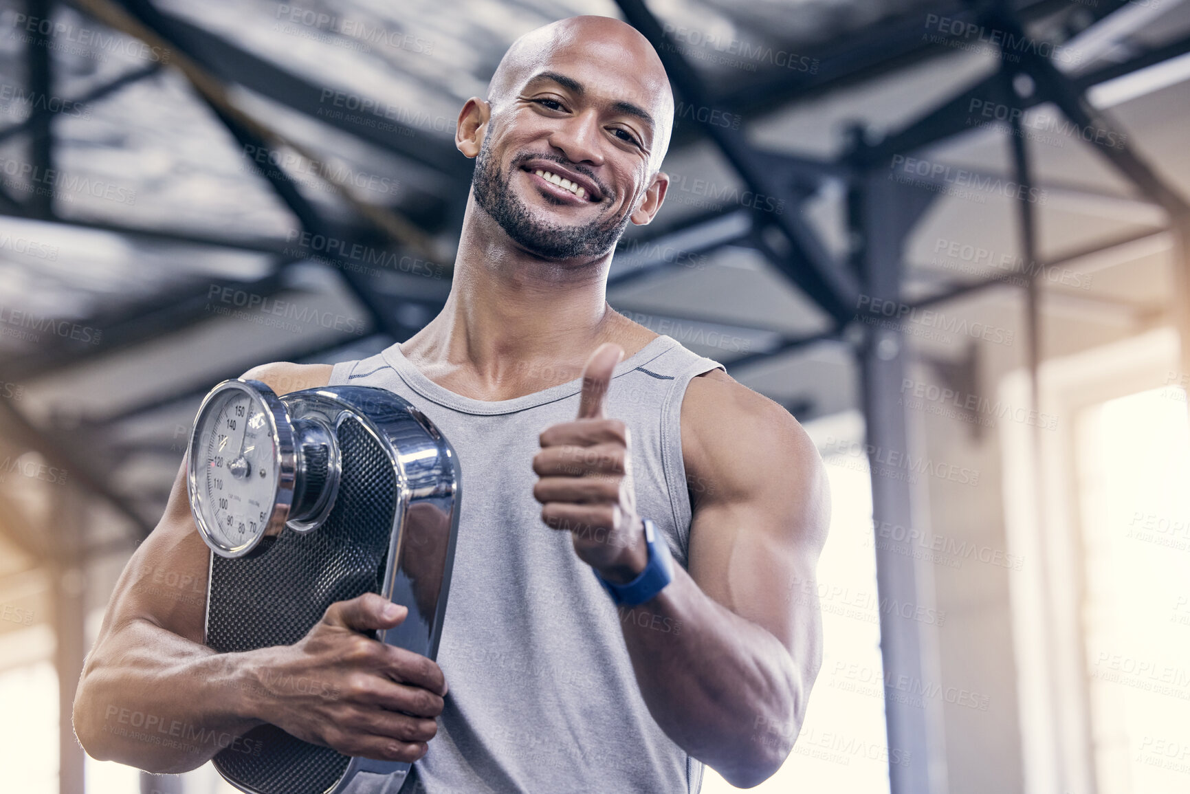 Buy stock photo Portrait, scale and thumbs up with bodybuilder man in gym for strength training or workout. Exercise, smile and success with happy athlete in health club for motivation, support or thank you