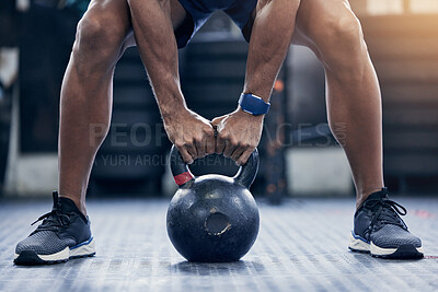 Buy stock photo Exercise, floor and kettlebell with a bodybuilder man in the gym for a weightlifting workout routine. Fitness, hands and strong with a male athlete holding a weight in a sports club while training