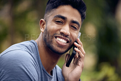 Buy stock photo Phone call, man and college student in park, portrait and smile with connection to contact and chat. University, education and person in campus with mobile, speaking and check for update in studying