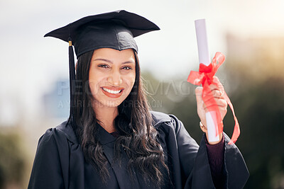 Buy stock photo Cropped portrait of an attractive young female student celebrating on graduation day