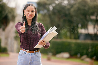 Buy stock photo Shot of a young woman showing thumbs up outside at college