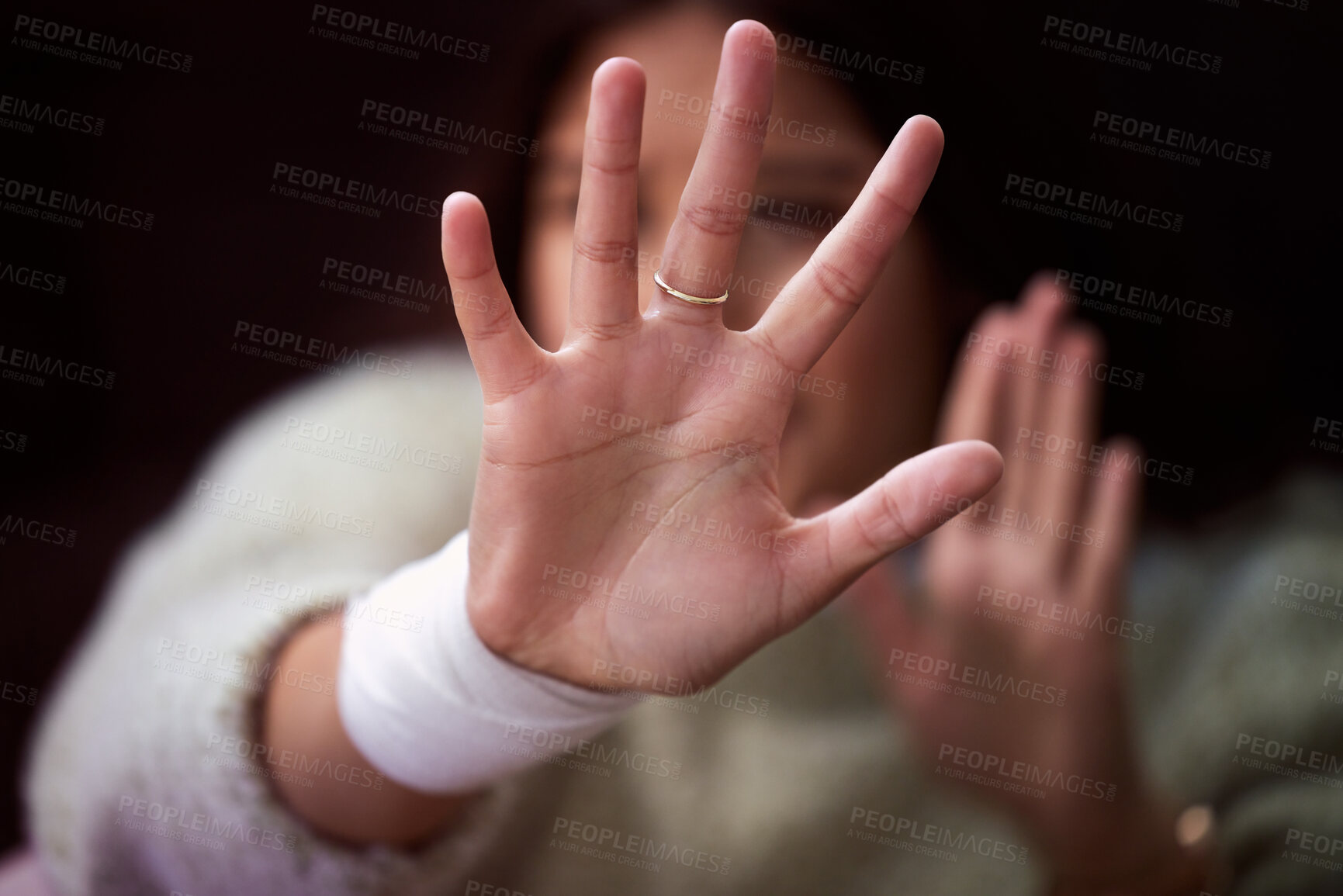 Buy stock photo Abuse, domestic violence and hands of woman for self defense in studio on dark background. Scared, stop or victim and person reaching palm to shield from physical danger with fear, horror or stress