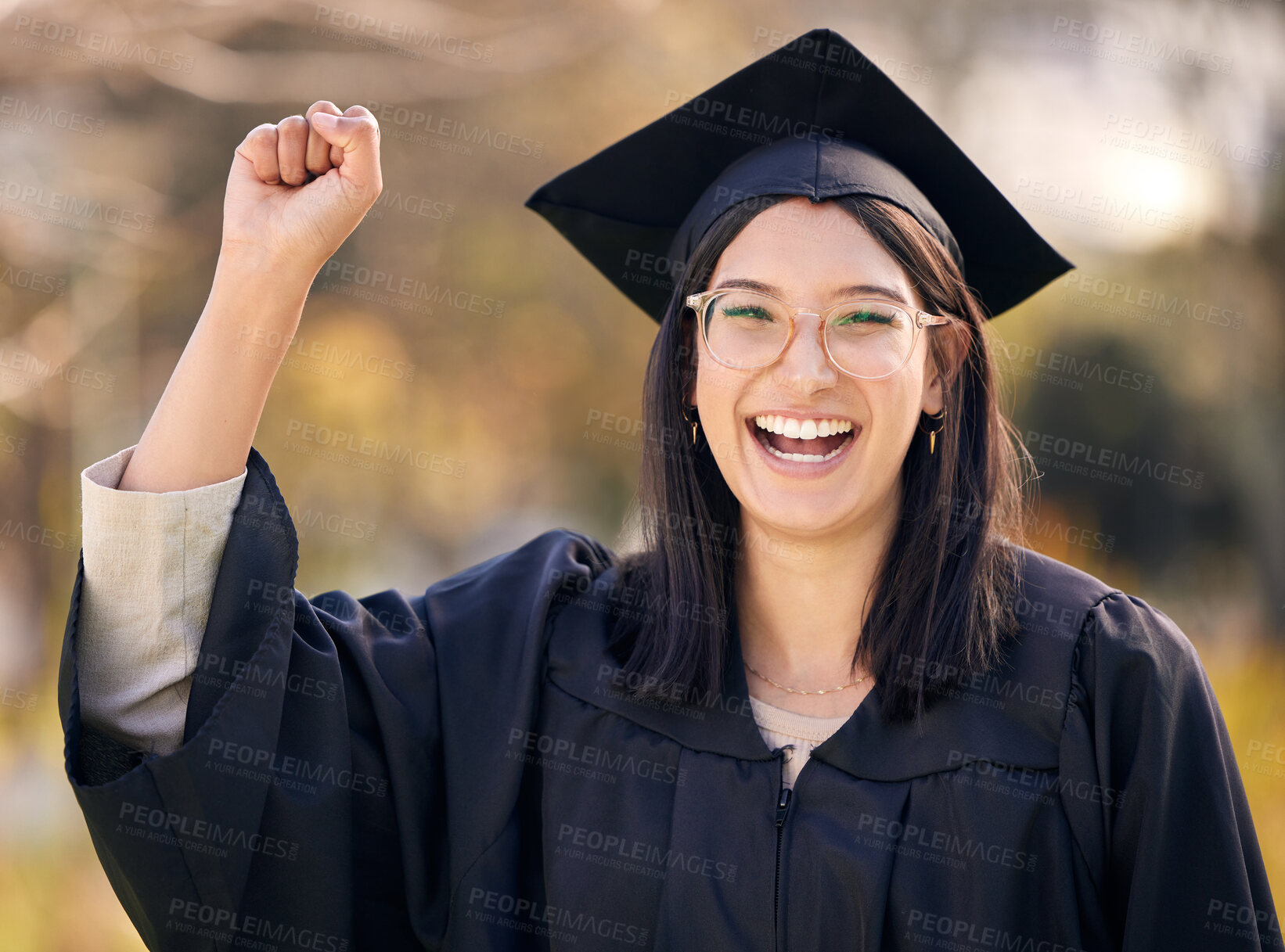 Buy stock photo Success, college portrait and woman for graduation with celebration, scholarship and milestone for university. Female graduate, smile and hand with power emoji in campus for achievement and education
