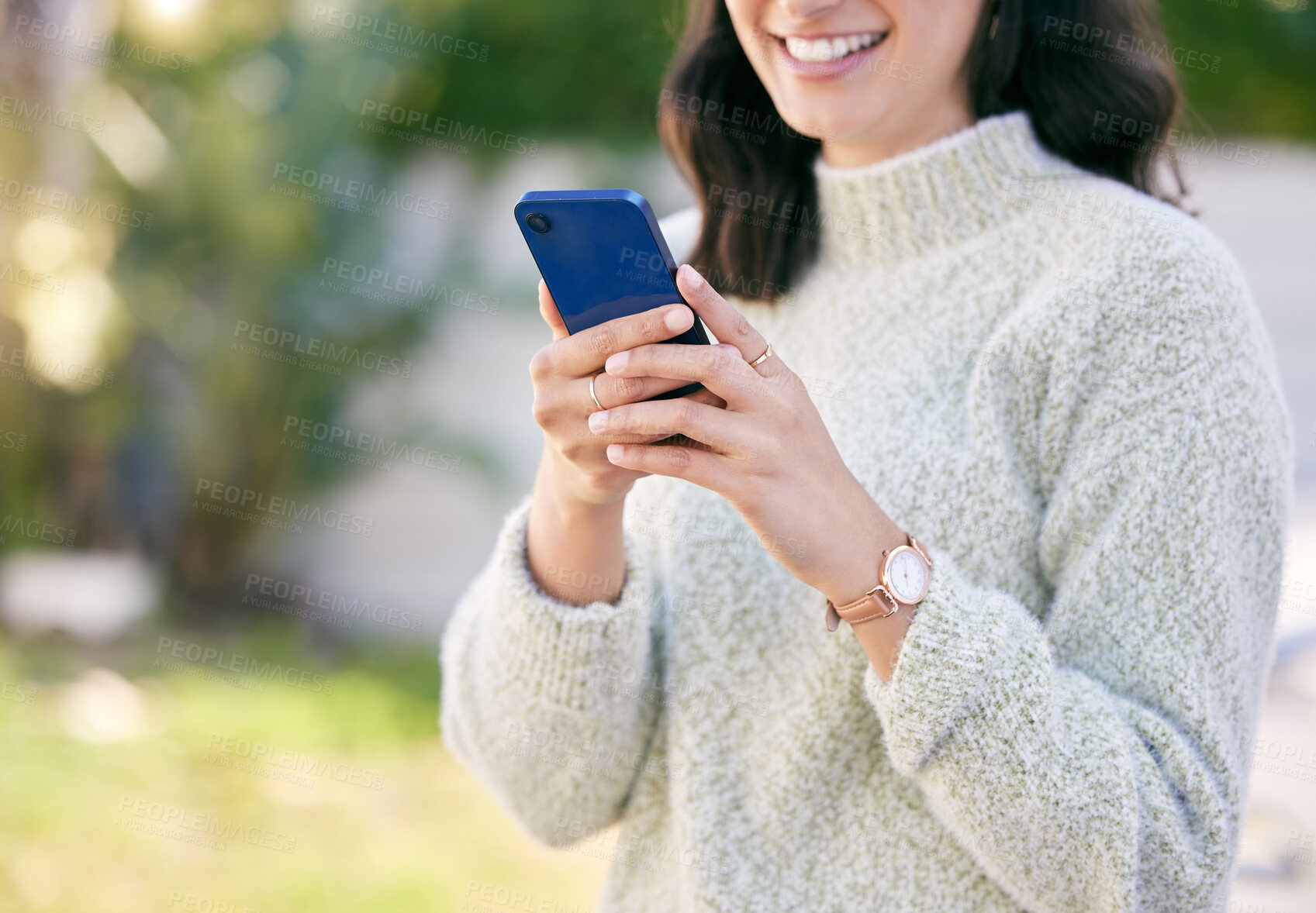 Buy stock photo Hands, phone or girl in park to chat on social media, internet post or news website notification in nature. Outdoor, smile or happy woman of texting, networking or typing online on blog or mobile app