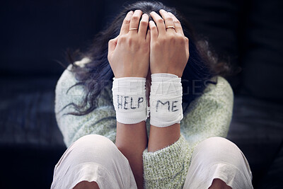 Buy stock photo Wrist, depression and woman with help on bandage for suicide, self harm or person in dark mental health crisis. Bandages, girl and injury from depressed accident, problem or mistake in cutting wrists