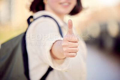 Buy stock photo Cropped shot of a woman showing thumbs up while standing outside