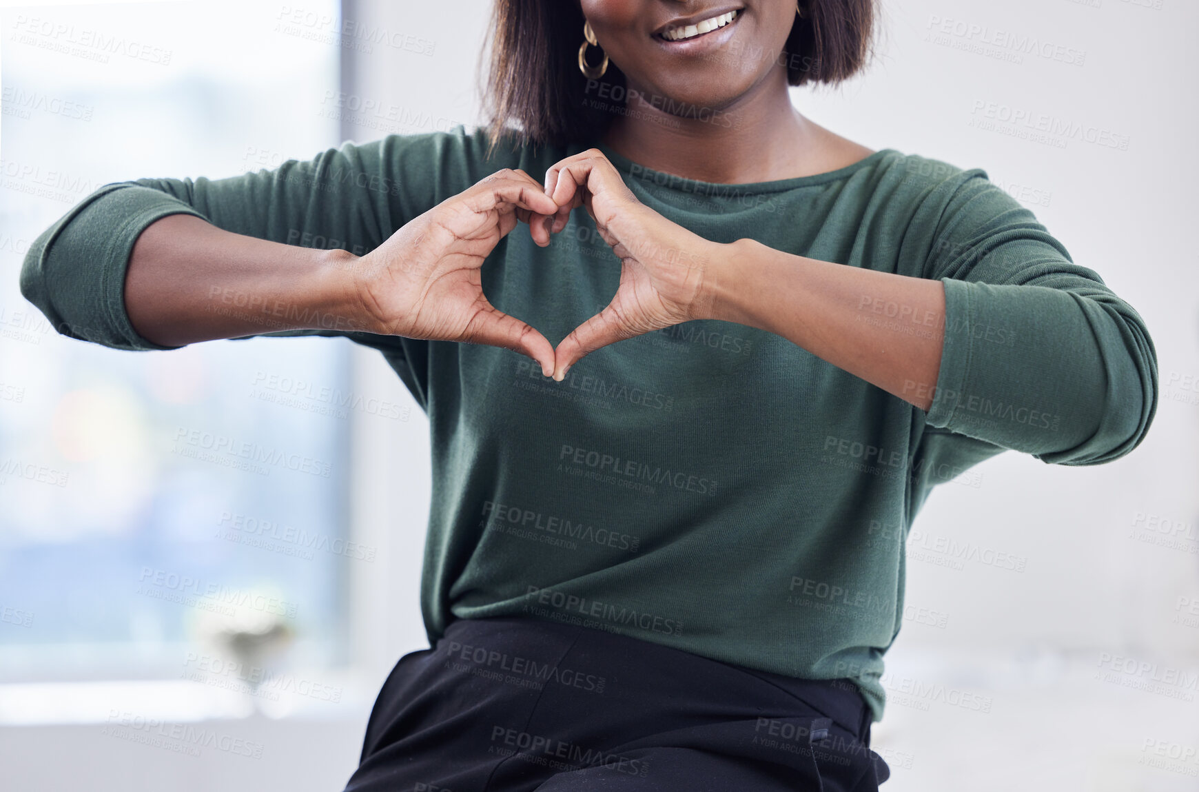 Buy stock photo Happy, business woman and hand for heart gesture, employee support and care in office. Smile, female person or human resources manager and love expression for empathy, understanding and kindness